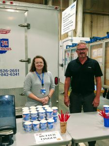 Ashley DeHart and Don Conrad passing out ice cream to all members.